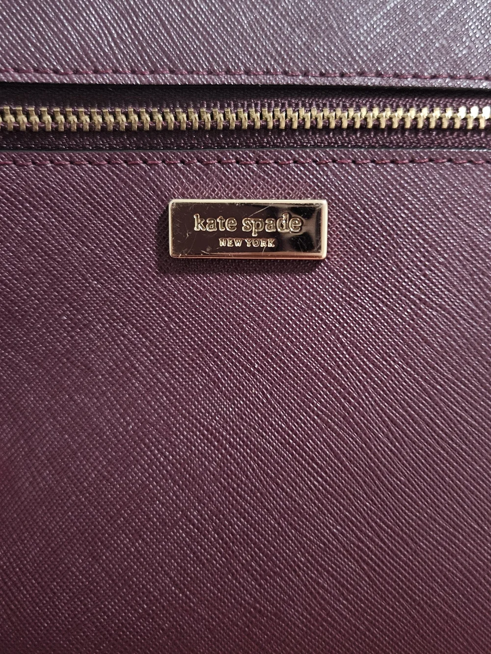 kate spade burgundy wristlet with gold hardware